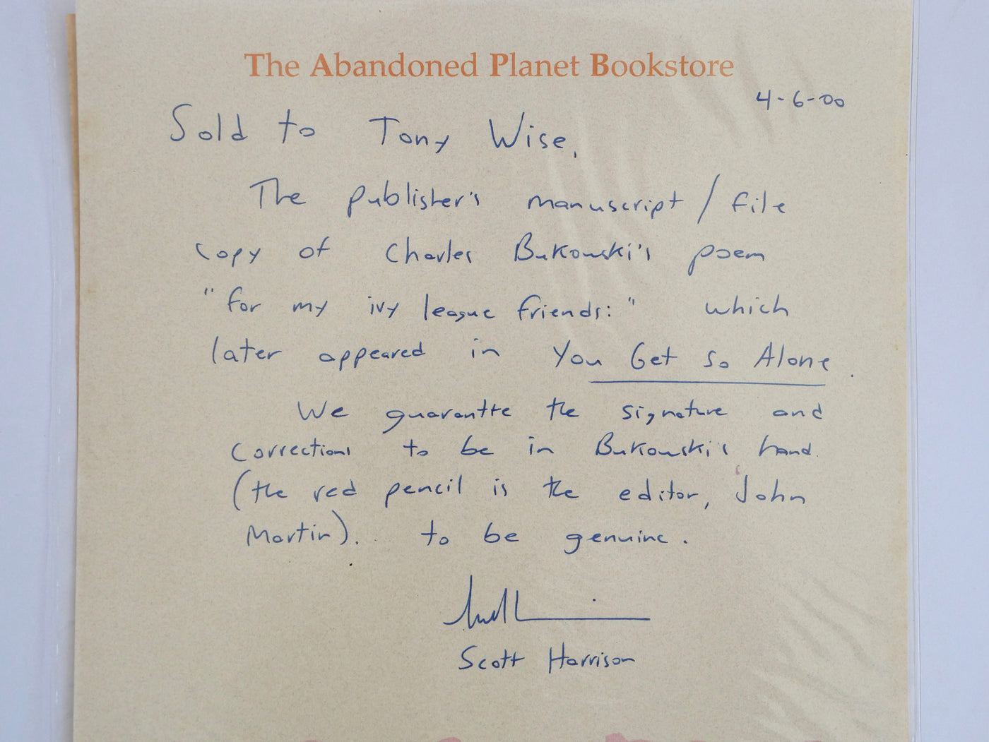 The Abandoned Planet Bookstore guarantee, signed by Scott Harrison, 6 April 2000, warranting the signature and corrections in Bukowski's hand and the red pencil as John Martin's