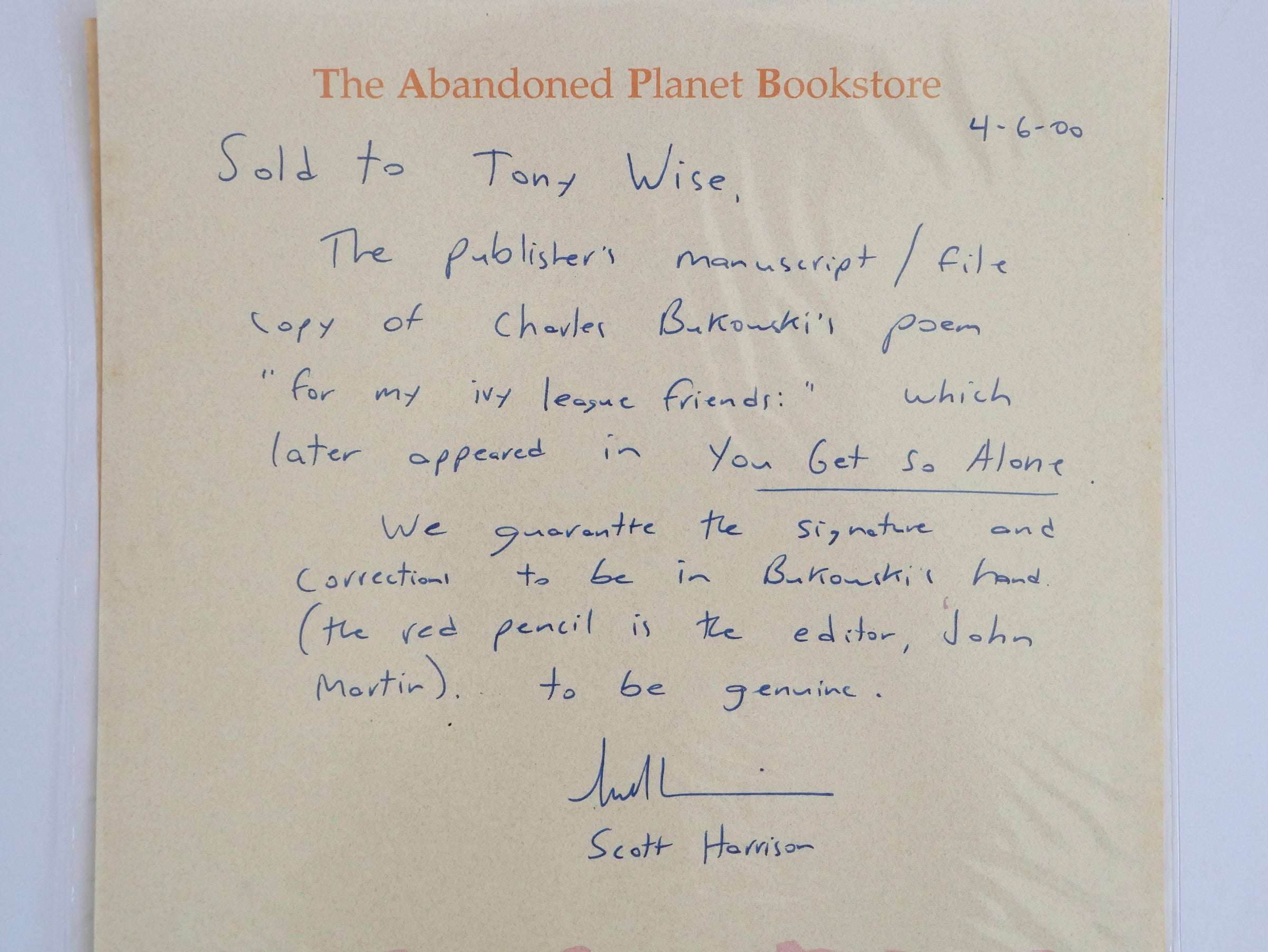 The Abandoned Planet Bookstore guarantee, signed by Scott Harrison, 6 April 2000, warranting the signature and corrections in Bukowski's hand and the red pencil as John Martin's