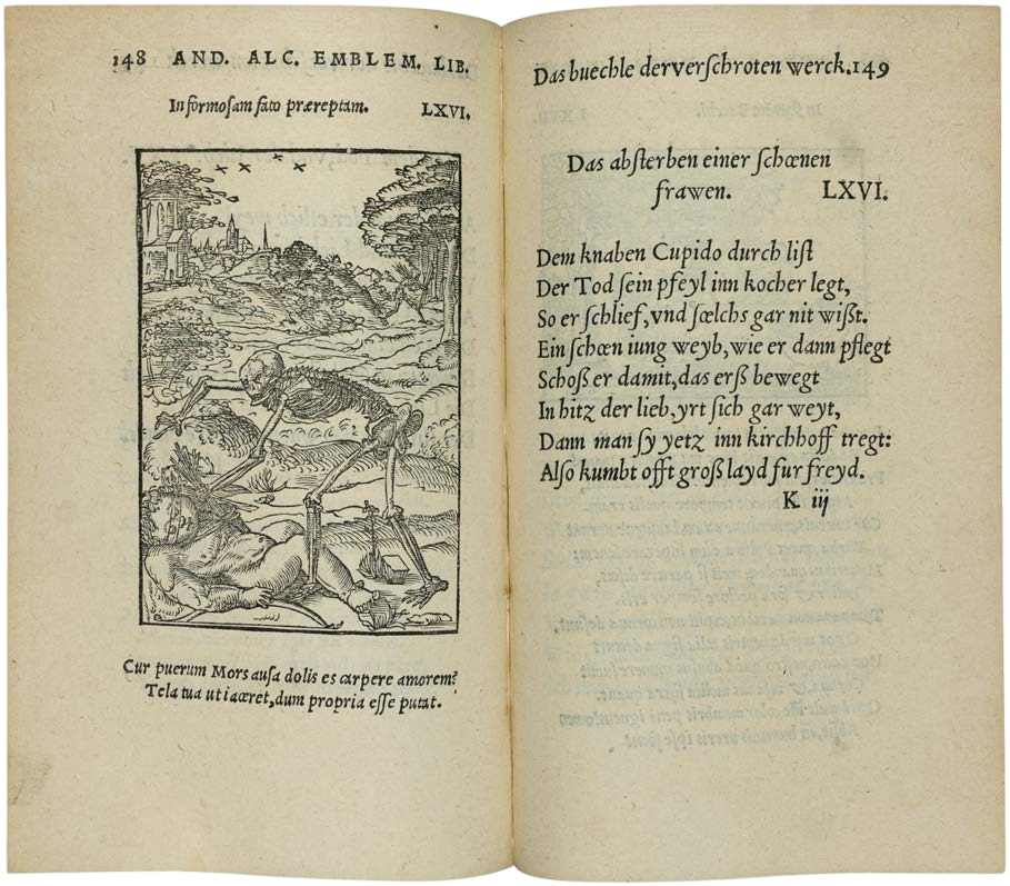 Open book with text and a black-and-white illustration on aged paper