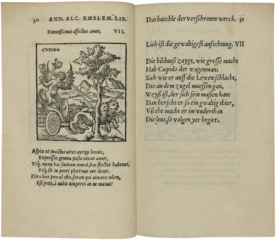 Open book with text and an illustration of a chariot and tree