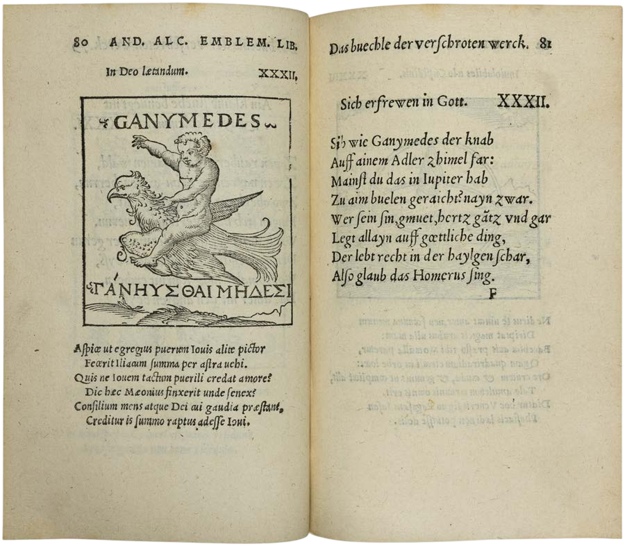 Open book with classical text and illustration on aged paper