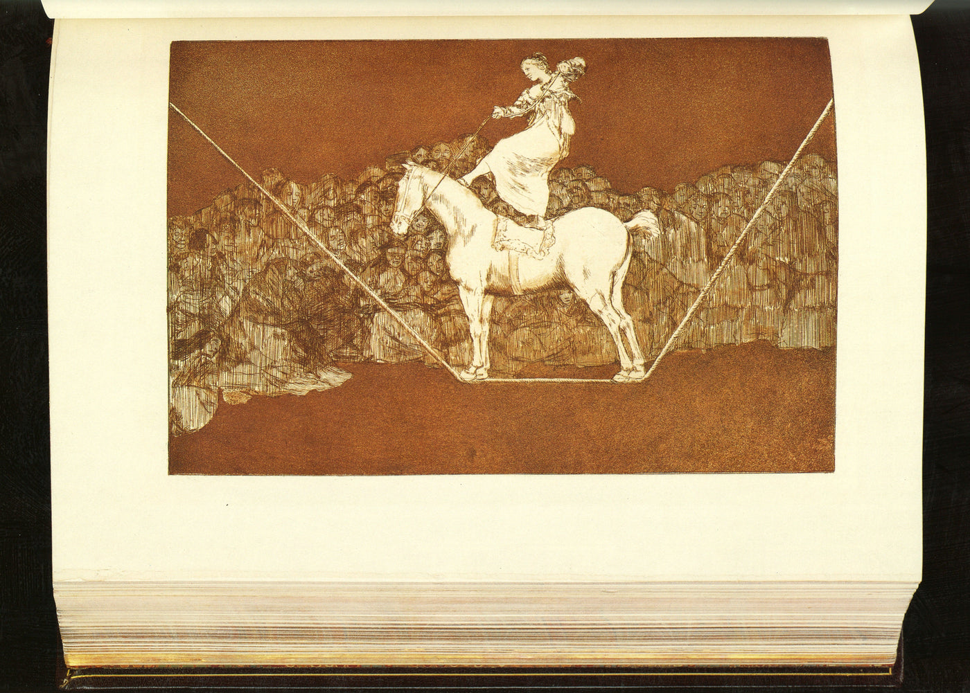Goya, Disparate puntual (Harris 267), proof before letters, printed in reddish brown on Whatman paper. A woman stands upright on a horse balanced on a rope above a crowd. Lettered Una reina del circo in 1877. The copper: Louvre, Chalcographie, inv. 11443.