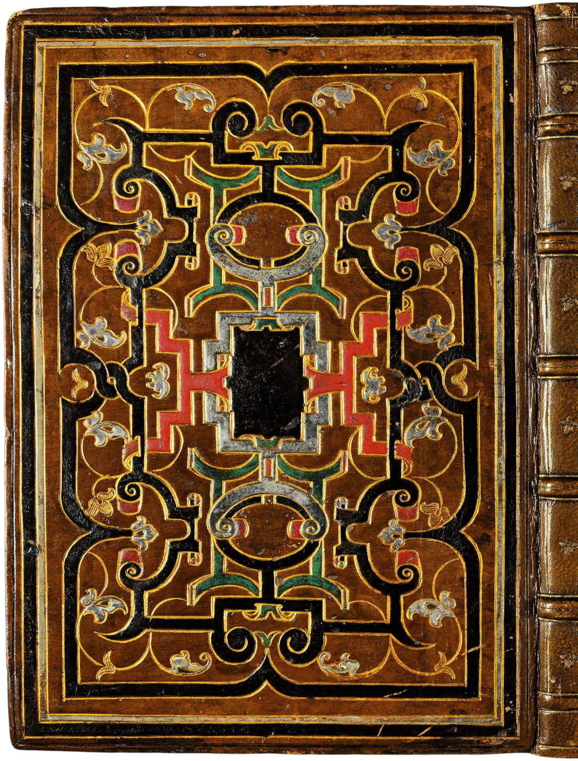 Decorative book cover with intricate patterns on a brown background