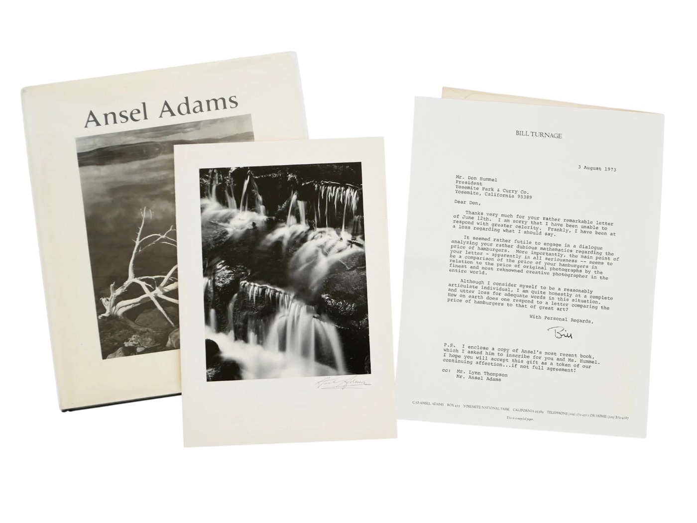 Ansel Adams book with black and white photographs of nature on a white background
