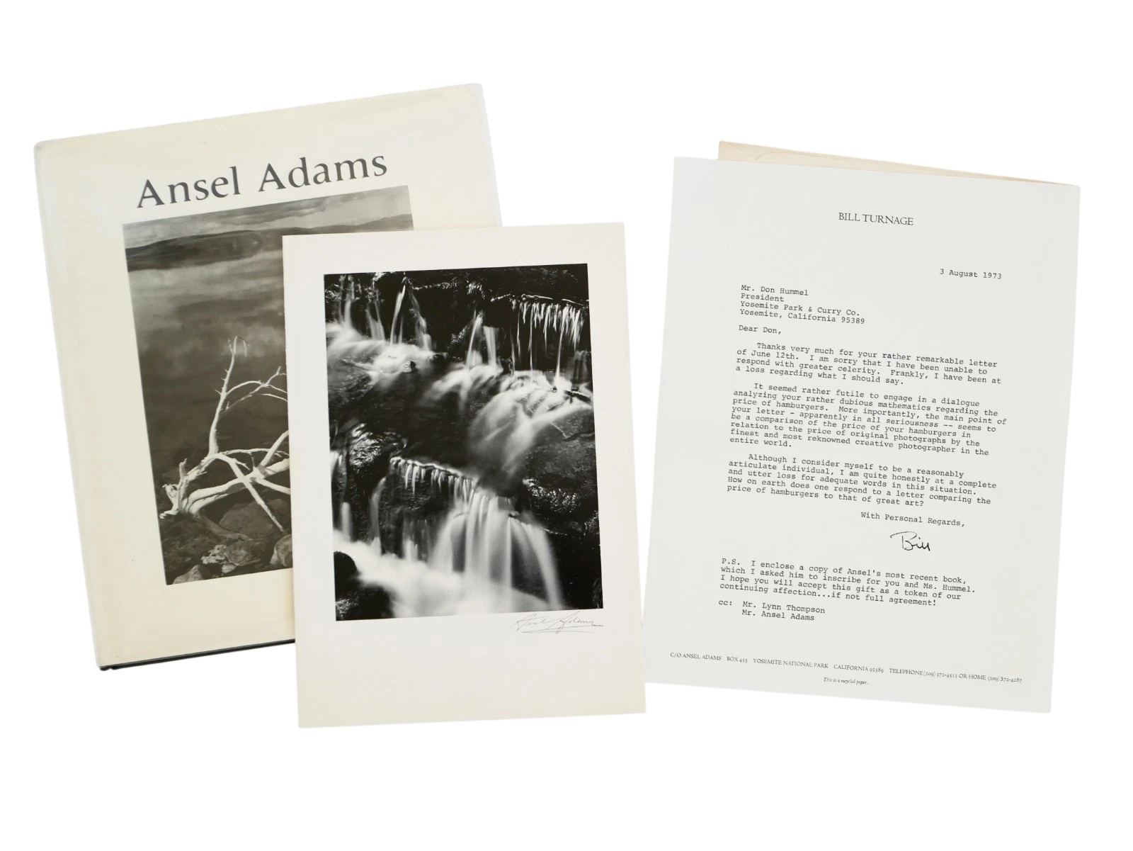 Ansel Adams book with black and white photographs of nature on a white background
