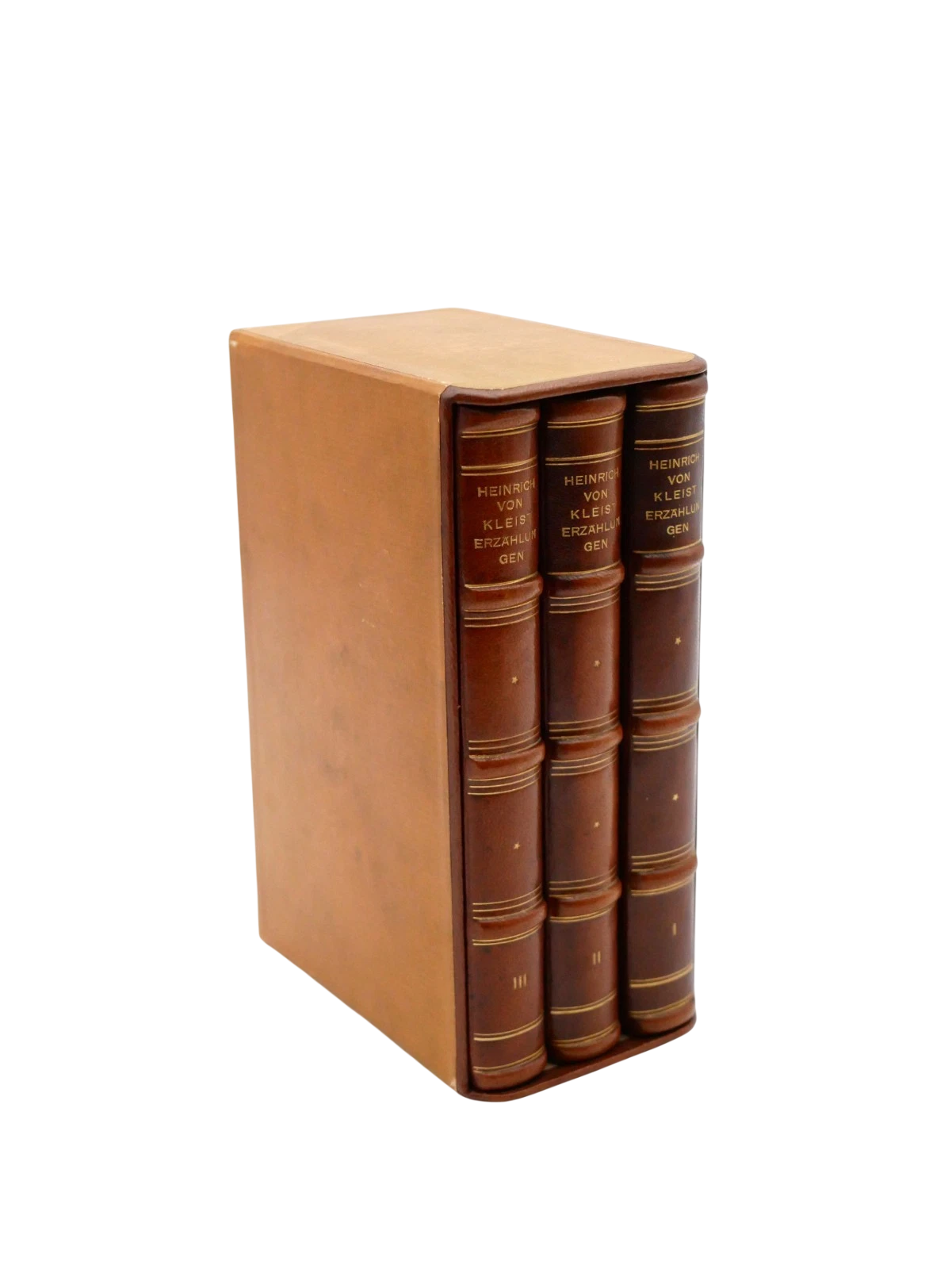 Set of three leather-bound books with a brown cover on a white background
