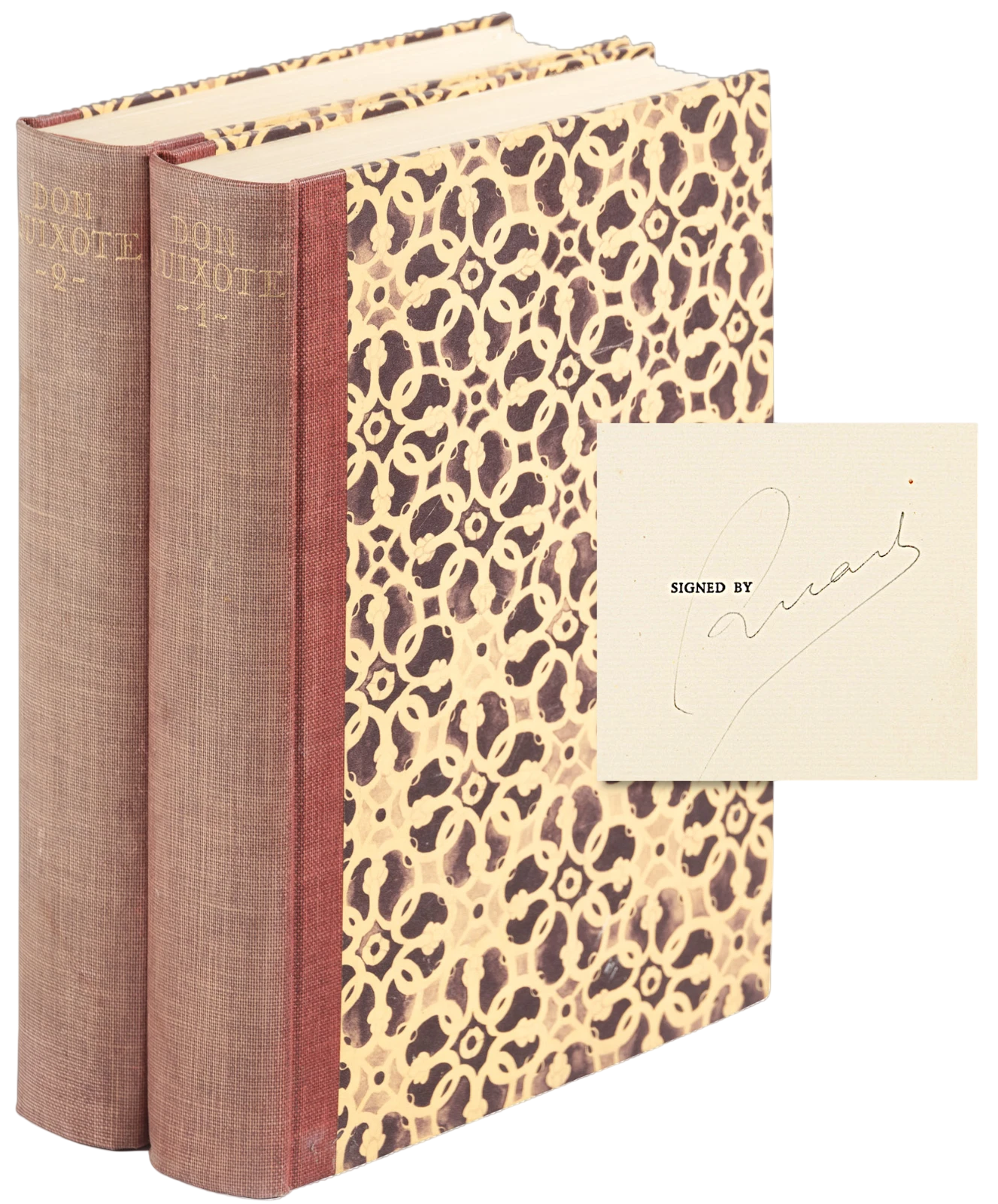 Two books with patterned spines and a signed card on a white background