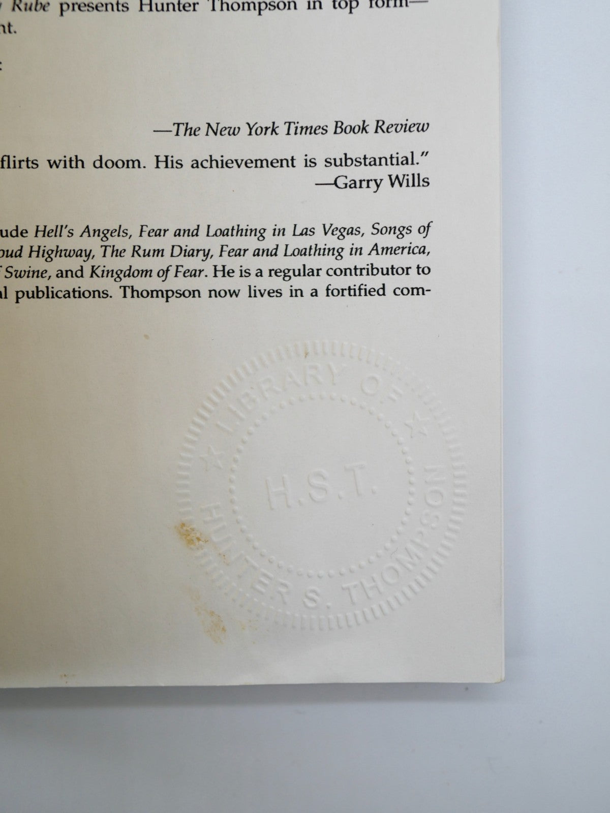 Publicity leaf with the blind-embossed Library of H.S.T. seal